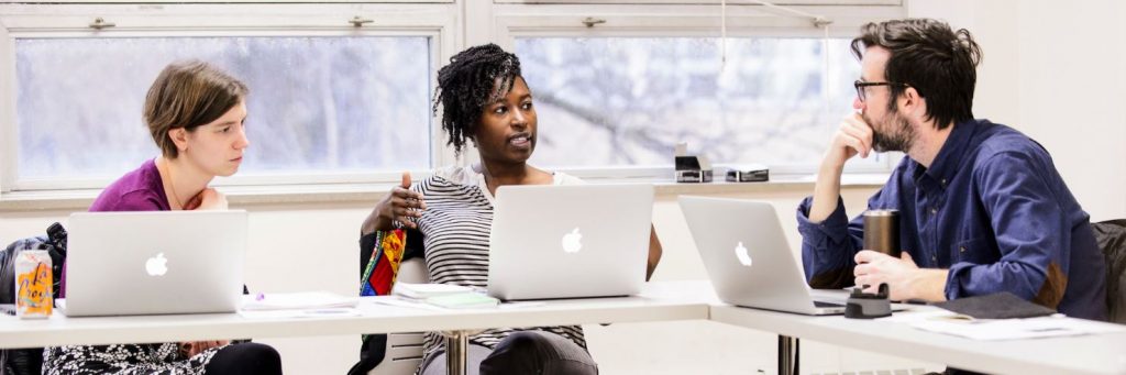 An educator talks to two other educators participating in The Discussion Project